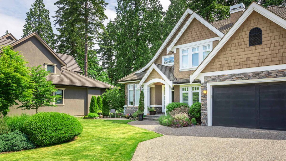 Detached family home with well-maintained landscaping, representing property types covered by home insurance policies.
