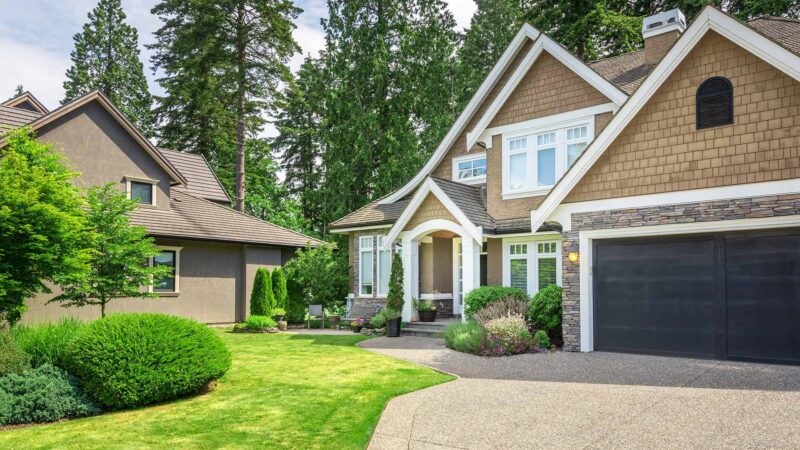 Detached family home with well-maintained landscaping, representing property types covered by home insurance policies.