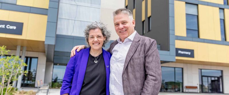 Kristie Gallo, Account Executive at Progressive and Keith White, CEO at Oshawa Clinic Group in front of Whitby Health Centre
